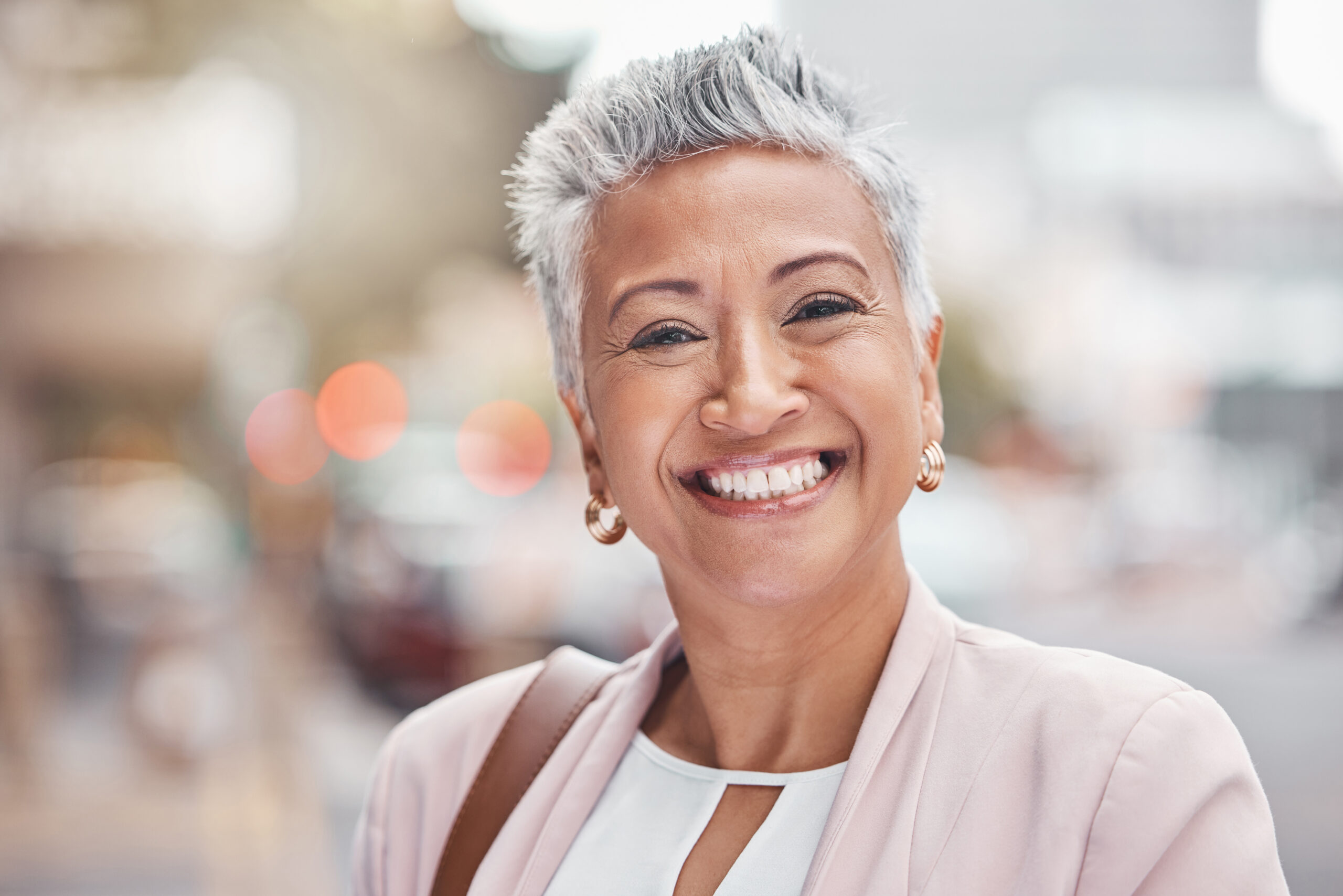 a senior woman smiling after dental treatment in chicago IL