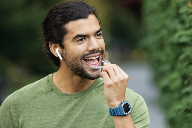 a man wearing invisalign aligners at Lux Smiles